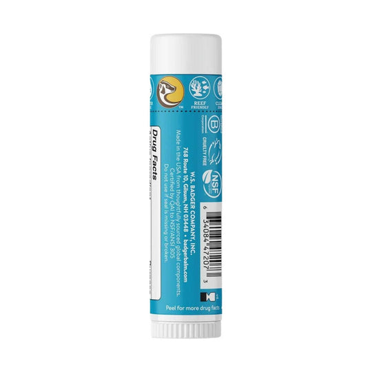 Blue sunscreen stick tube with white cap, showing Reef Friendly, Cruelty Free, NSF, and Drug Facts label