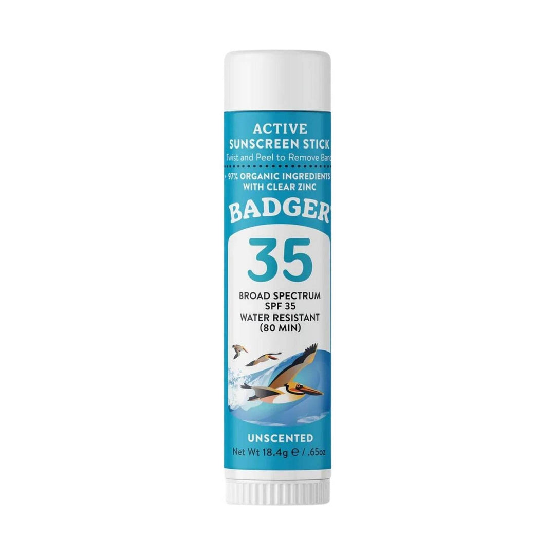 Blue-and-white sunscreen stick tube with 35 label and whale illustration
