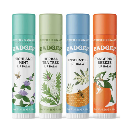Four lip balm tubes labeled Highland Mint, Herbal Tea Tree, Unscented, and Tangerine Breeze.