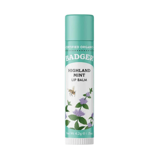 Mint-green lip balm tube with white label and floral mint illustration