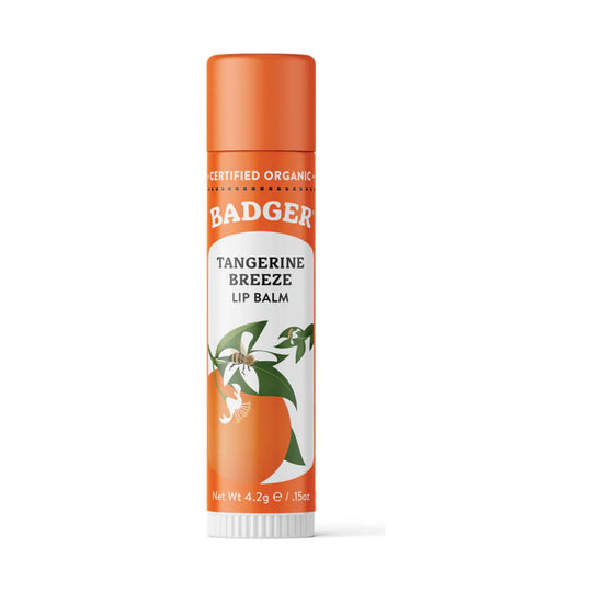 Orange lip balm tube with white botanical label and orange cap