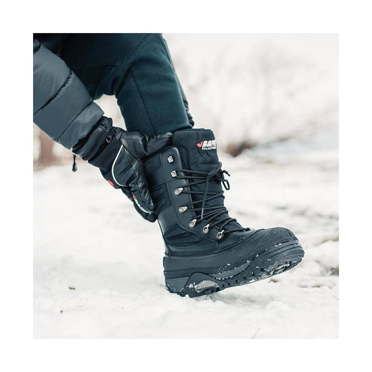 Black insulated winter boot with laces, tall cuff, and lug sole in the snow.
