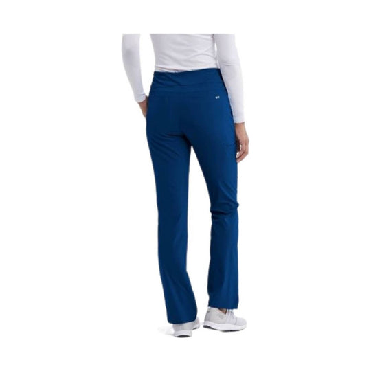 Blue women’s cargo scrub pants with a mid-rise waistband and straight leg, shown from the back