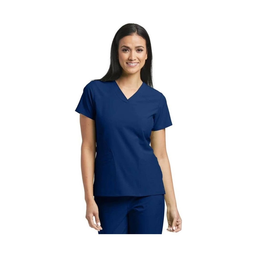Navy short-sleeve V-neck scrub top and matching scrub pants on a model against a white background