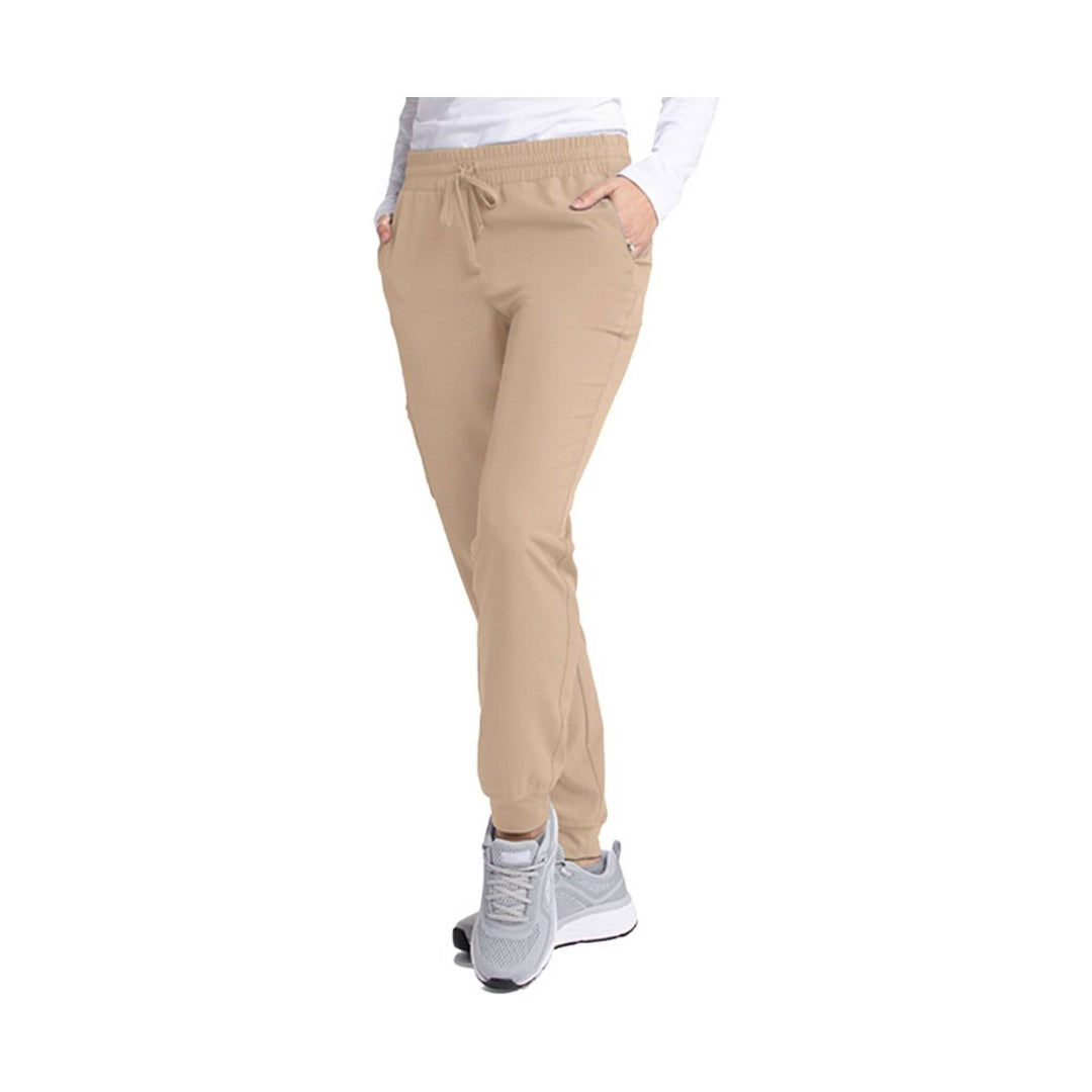 Beige jogger scrub pants with drawstring waist, side pockets, and tapered legs