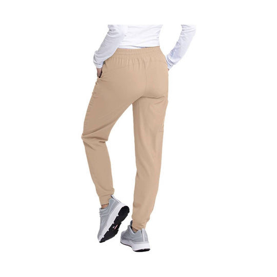 Beige jogger scrub pants shown from the back with an elastic waistband and tapered legs