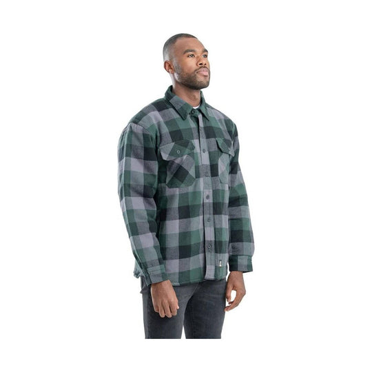 Plaid long-sleeve button-up shirt with chest pockets and collar, shown on a model