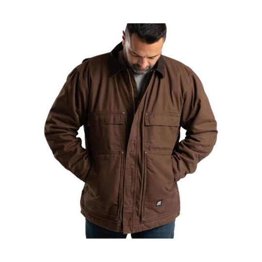 Brown zip-front chore coat with flap chest and lower pockets, worn over jeans