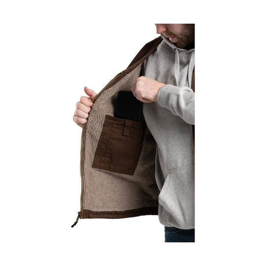 Brown sherpa-lined vest worn open over a gray hoodie, showing an interior chest pocket