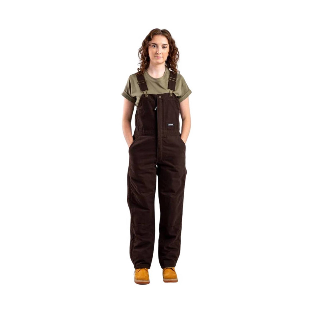 Brown insulated bib overalls over an olive T-shirt, shown full length with front pockets and shoulder straps