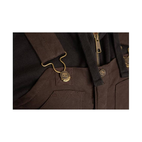 Close-up of brown insulated bib overalls with black straps and brass hardware