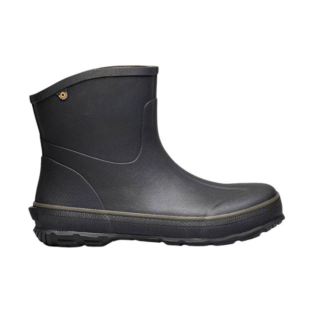 Black mid-height rubber work boot with a textured sole and curved upper cuff