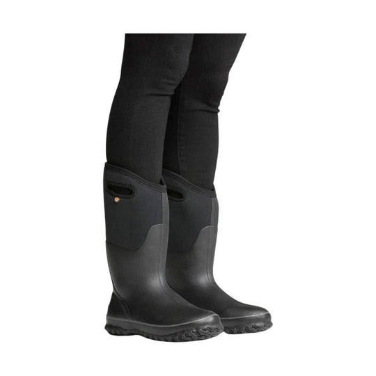 Black tall rain boots with pull handles and textured soles