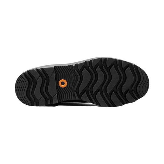 Black boot outsole with wavy tread pattern and an orange circular accent