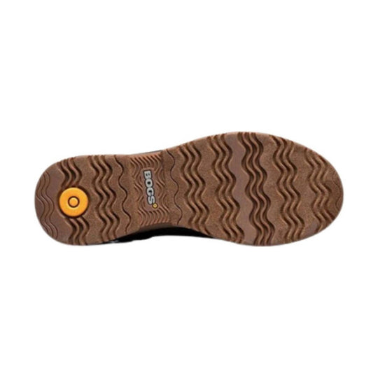 Brown boot outsole with wavy tread and a yellow circular Bogs logo