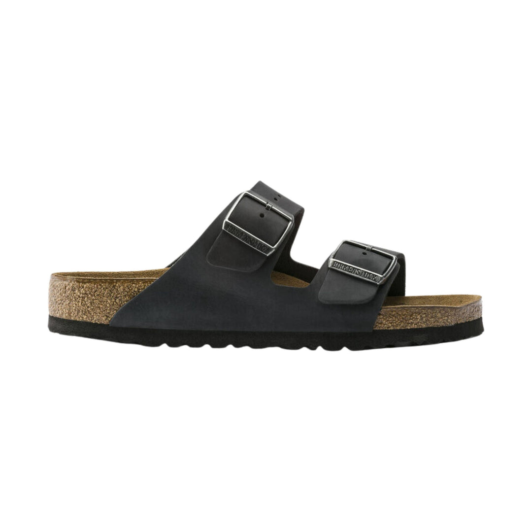 Black two-strap sandal with cork footbed and adjustable metal buckles
