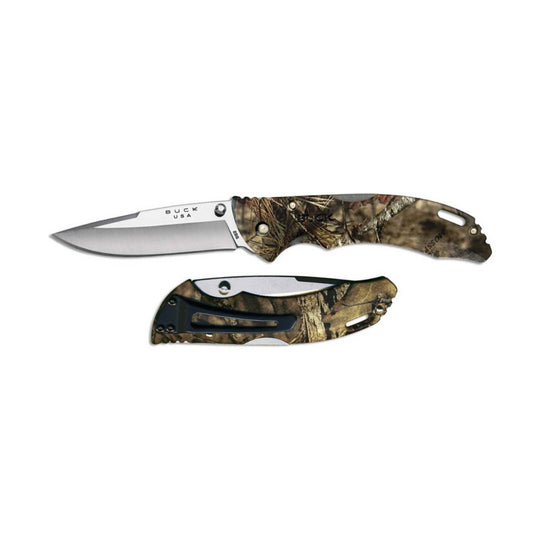 Two folding knives on a white background, one open and one closed, with camouflage handles and visible BUCK USA branding