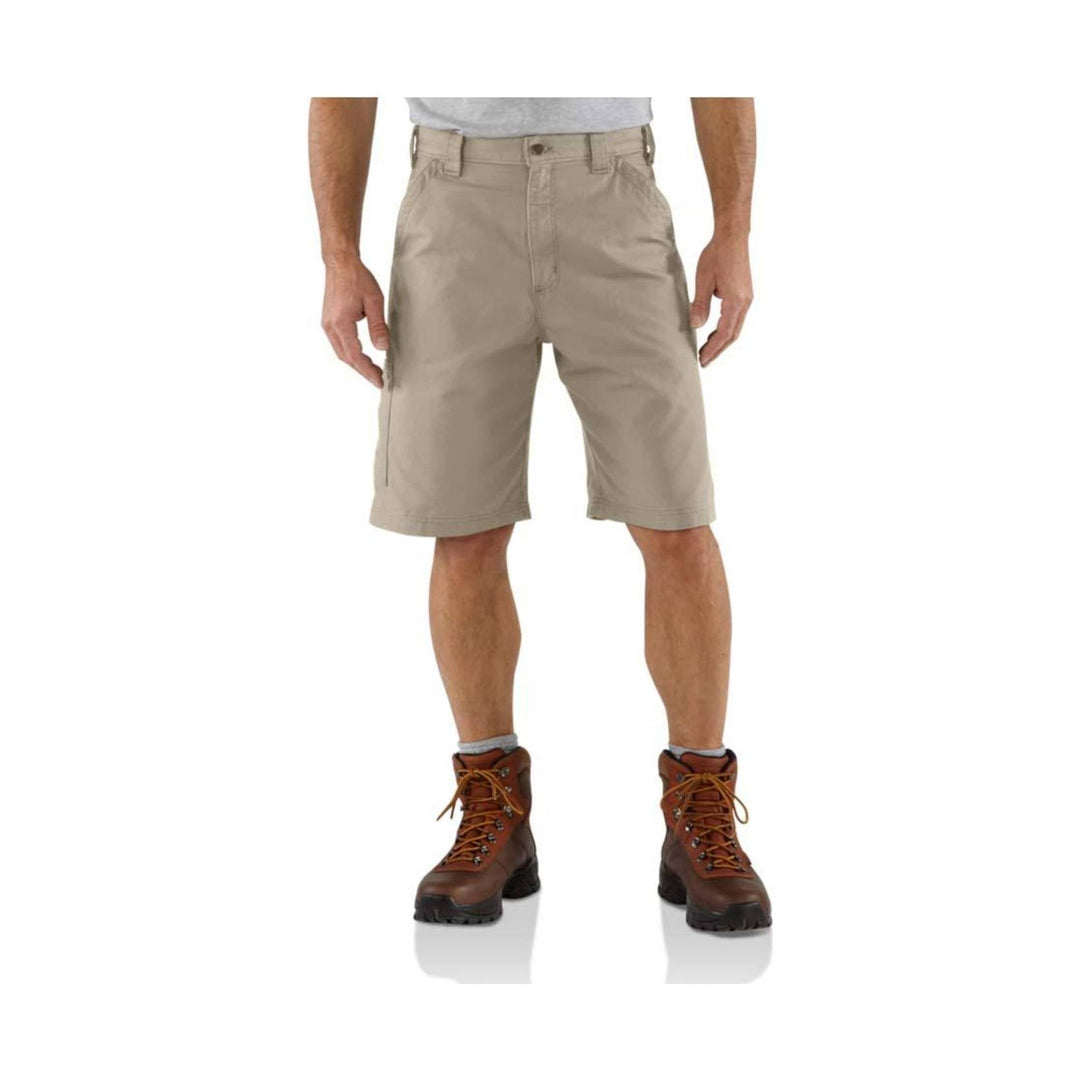 Khaki utility shorts with front cargo pocket and belt loops, shown with brown hiking boots