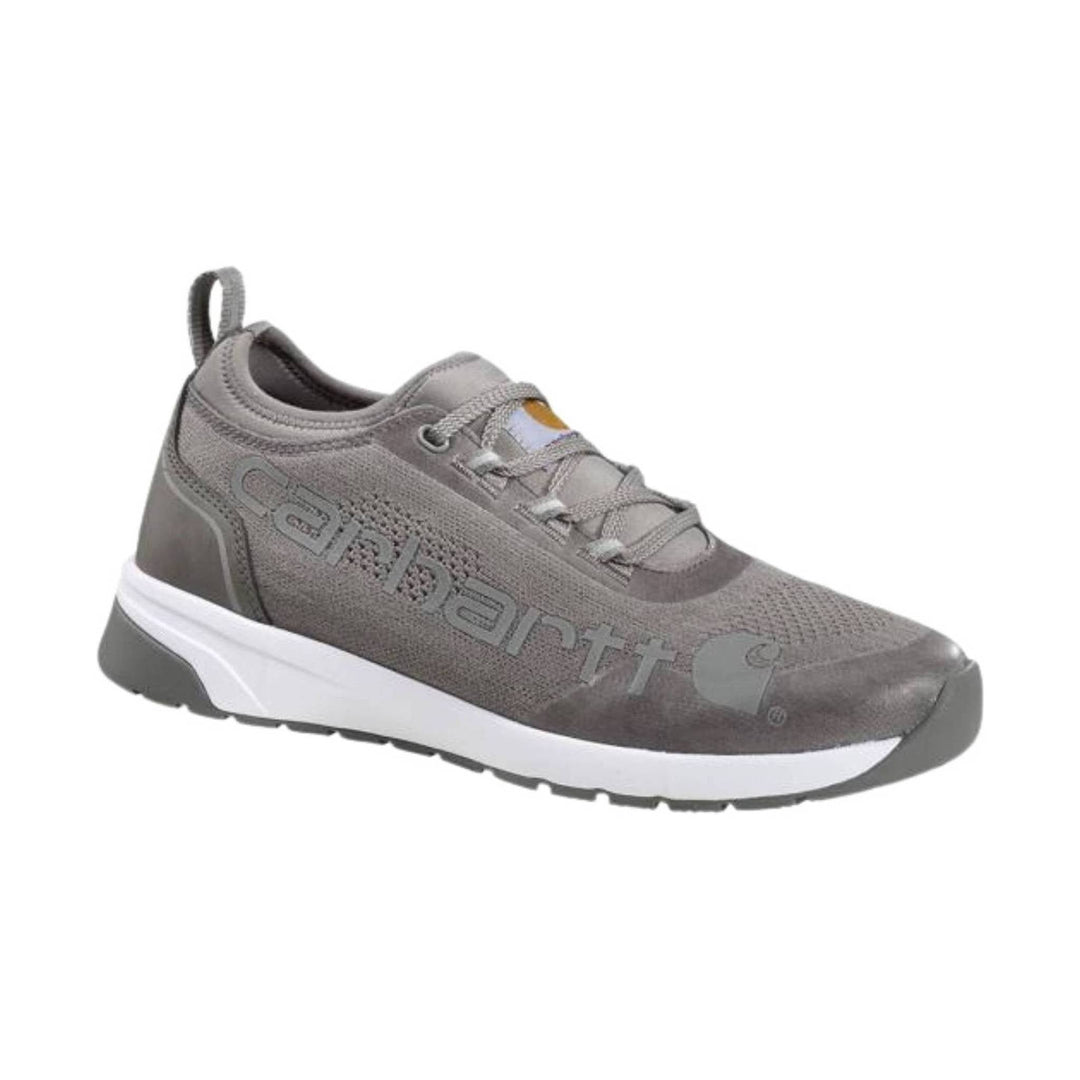 Grey low-top work shoe with white midsole, black tread, and Carhartt logo on the side.