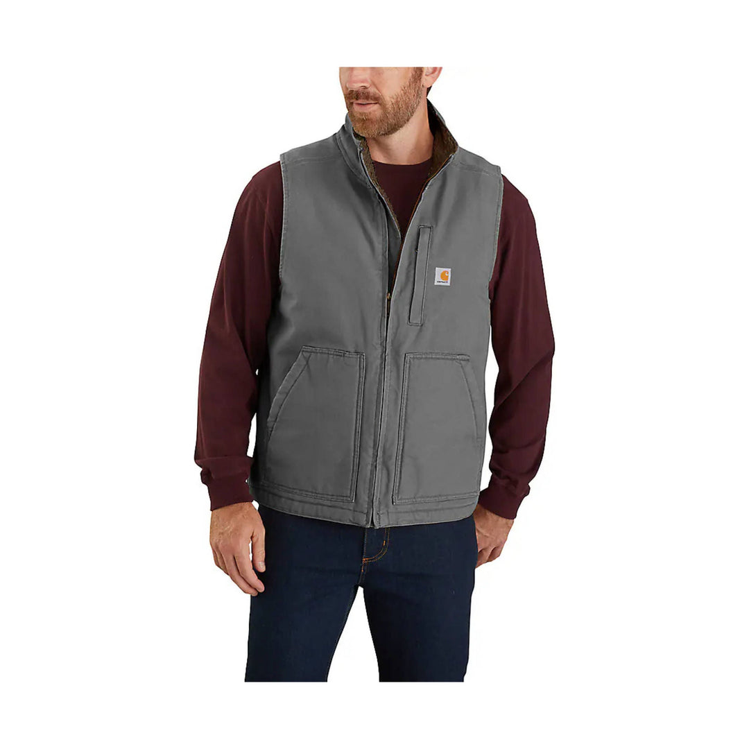 Gray insulated vest with front zipper, two large patch pockets, and a small Carhartt logo patch