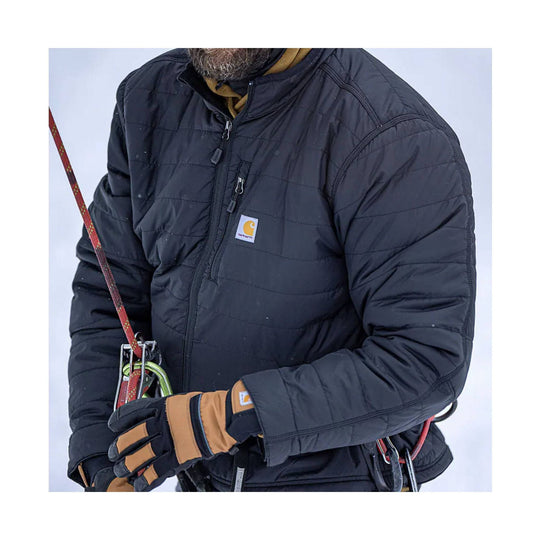 Black quilted insulated jacket with front zipper, chest pocket, and tan work gloves