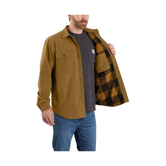 Tan button-up work jacket with chest pocket and plaid fleece lining, worn open over a dark T-shirt and jeans