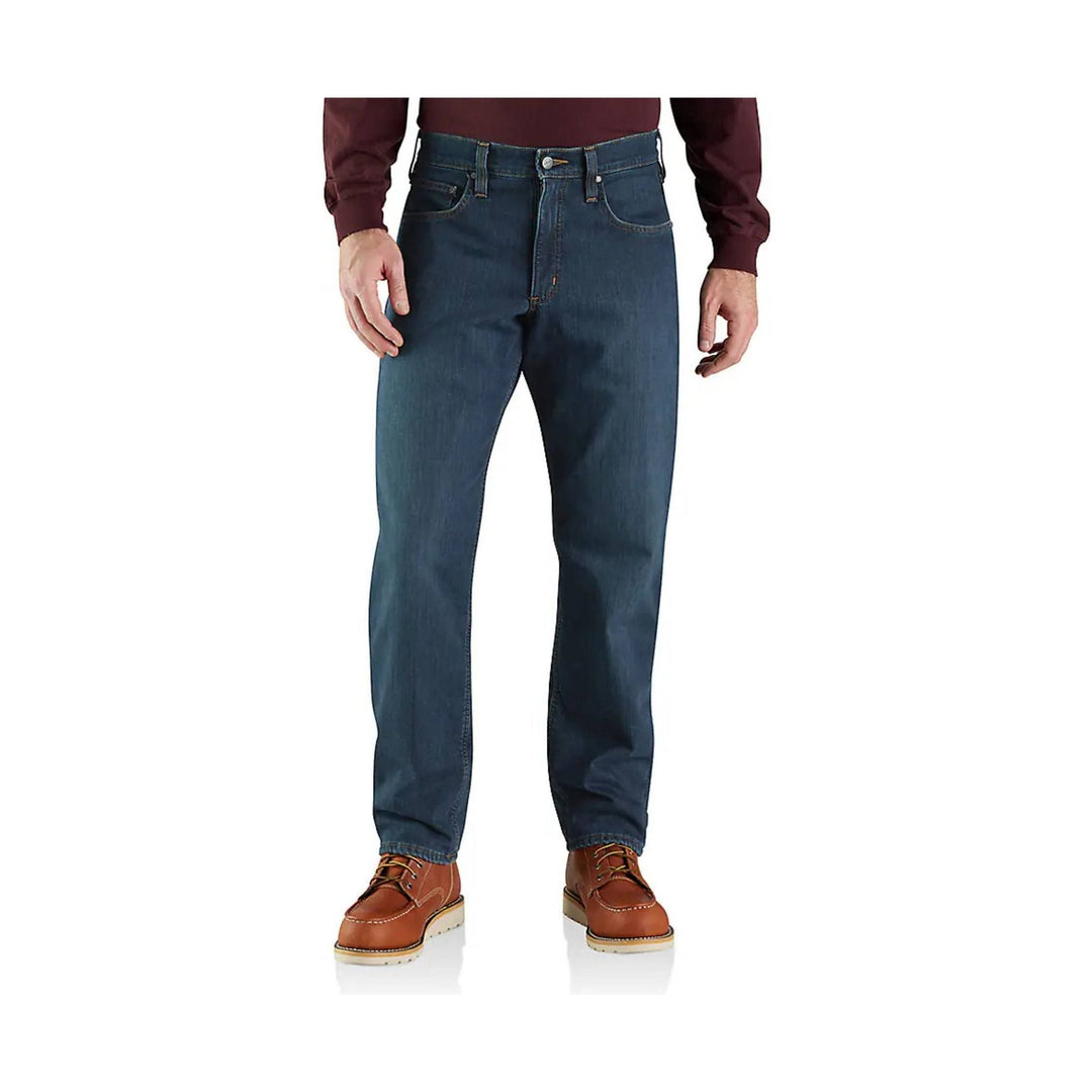 Dark blue men’s straight-leg jeans with front and back pockets, shown with brown shoes