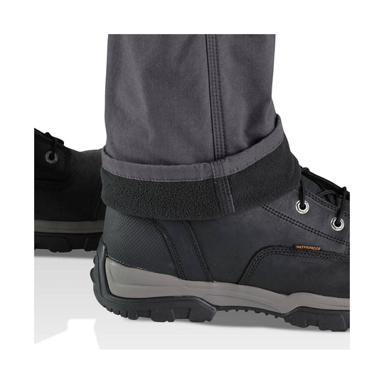 Black waterproof work boot with hiking-style laces and thick lug sole, shown with a pant cuff