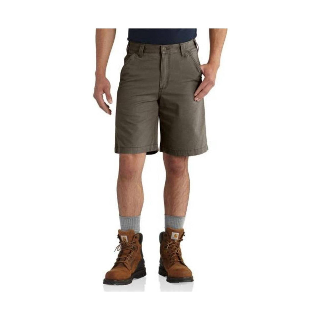 Olive cargo shorts on a male model with front pockets and knee-length hem