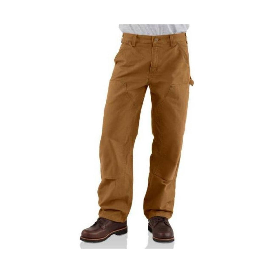 Brown work pants with reinforced knees and lace-up work boots