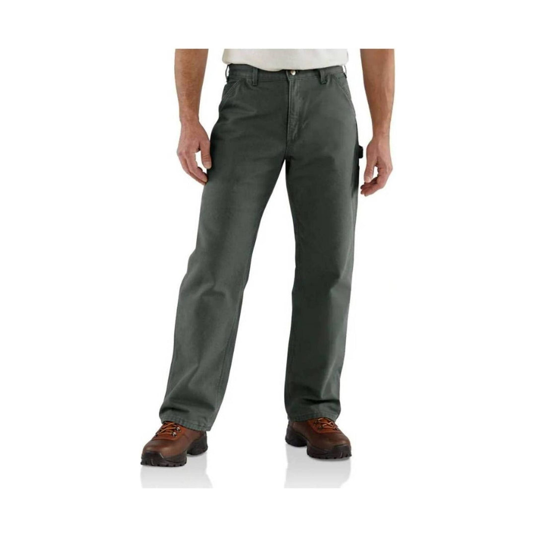 Dark olive work pants shown on a model with straight legs and rugged boots