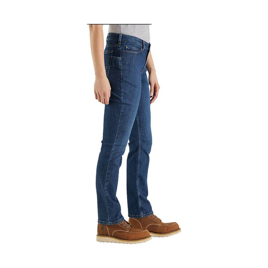 Side view of dark blue relaxed-fit jeans worn with tan work boots