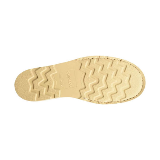 Tan boot outsole with zigzag tread and stitched edge