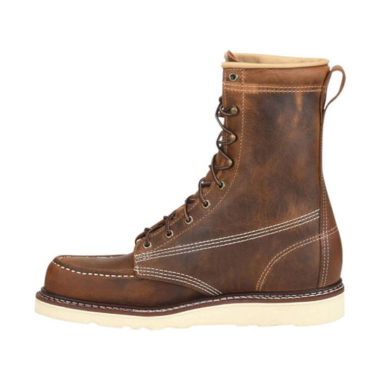 Brown leather lace-up work boot with a cream wedge sole