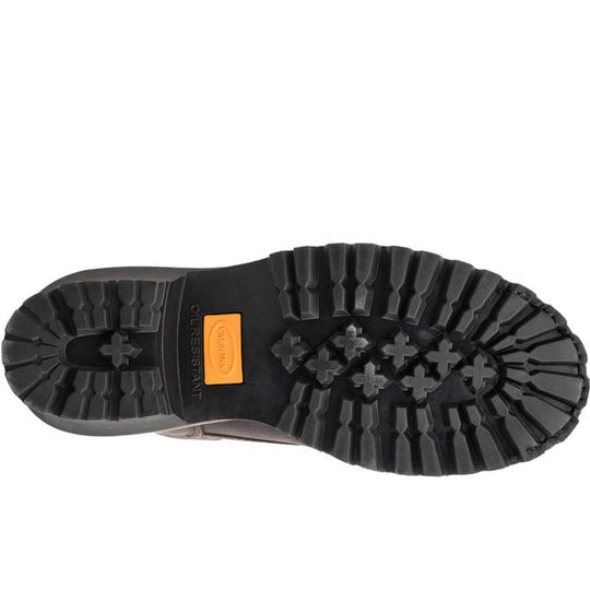 Black lugged boot outsole with deep tread and an orange Carolina insert
