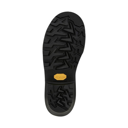 Black lugged boot outsole with a yellow Vibram badge