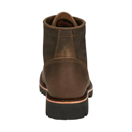 Brown leather work boot shown from the back with black lug sole and contrast stitching