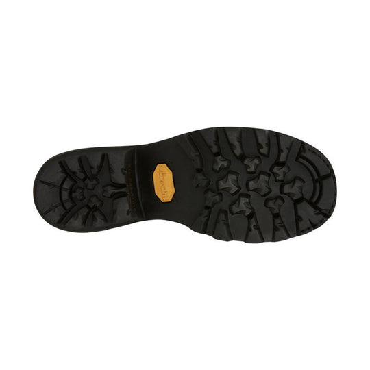 Black lugged boot outsole with a yellow Vibram badge