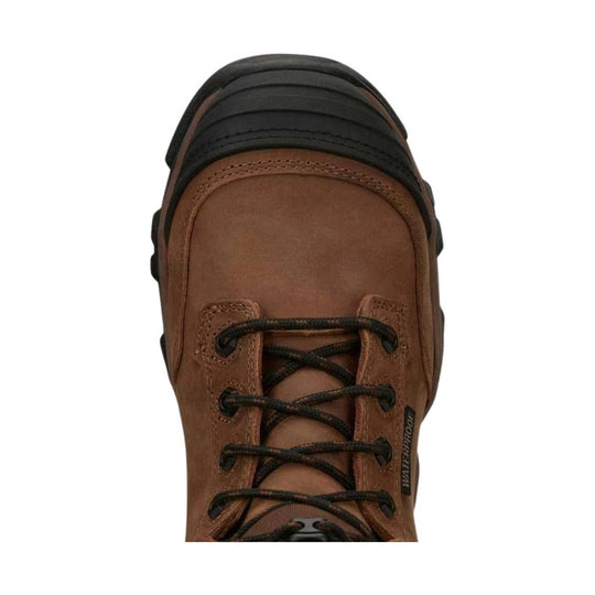 Brown leather hiking boot with black rubber toe cap and black laces, top-down view
