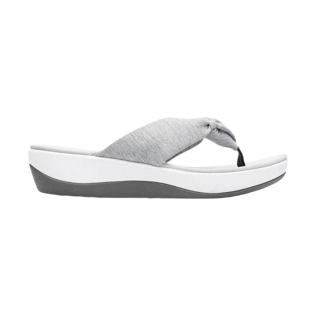 Grey fabric thong sandal with a white platform sole and dark gray wedge bottom
