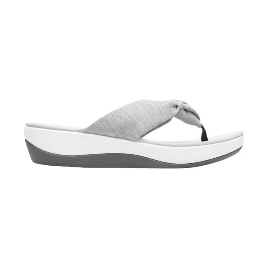 Grey fabric thong sandal with a white platform sole and dark gray wedge bottom