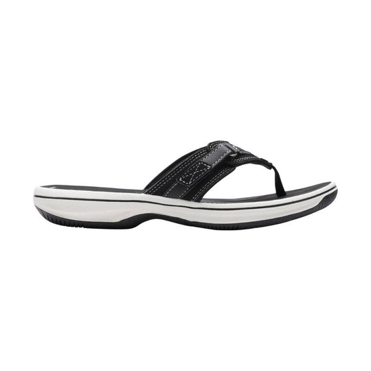 Black thong sandal with a white platform sole and stitched straps