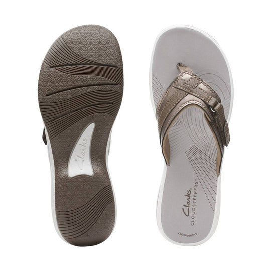 Taupe women’s sandal with toe loop, buckle strap, and cushioned sole shown top and outsole views