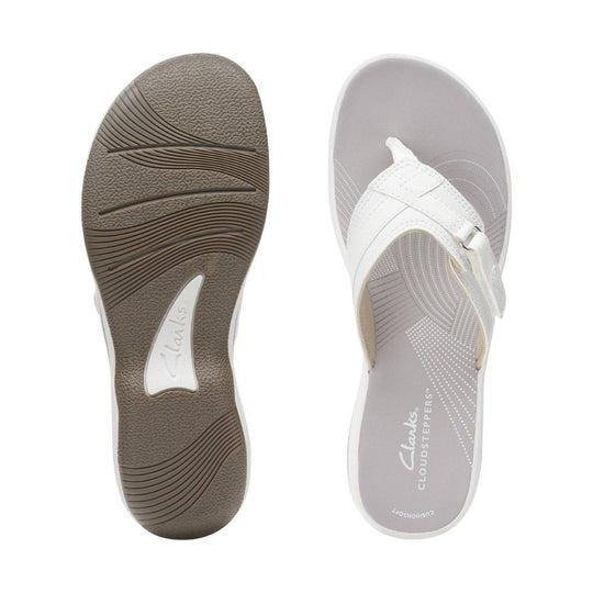 White thong sandal with a cushioned sole and printed footbed text