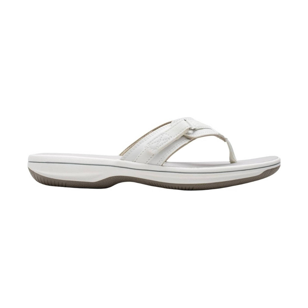 White thong sandal with a cushioned sole and crossed straps