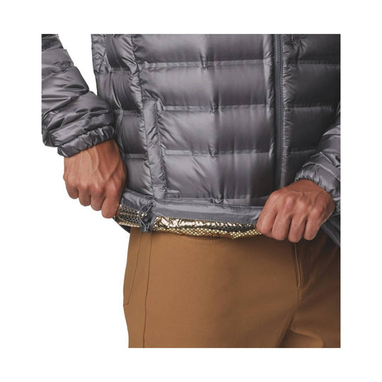Gray quilted puffer jacket with a front zipper and elastic cuffs, shown cropped at the waist