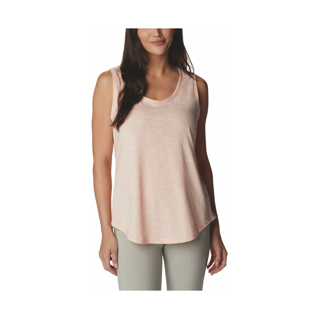 Light pink sleeveless tank top with a scoop neckline and rounded hem, worn with gray leggings