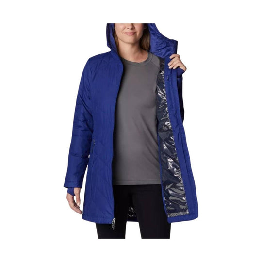 Woman modeling a blue hooded long jacket over a gray top and black leggings