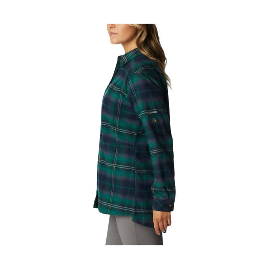 Long-sleeve plaid flannel shirt in green, navy, and black, shown in side view