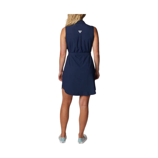 Sleeveless navy belted dress shown from the back